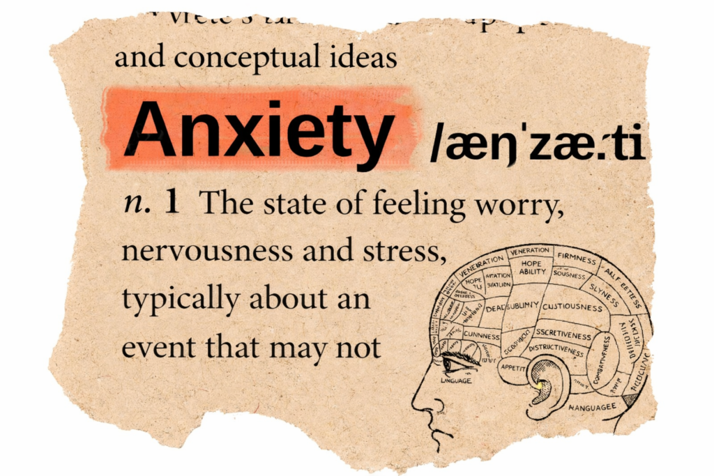 Anxiety definition highlighted in coral on vintage dictionary page with brain illustration representing psychological processing
